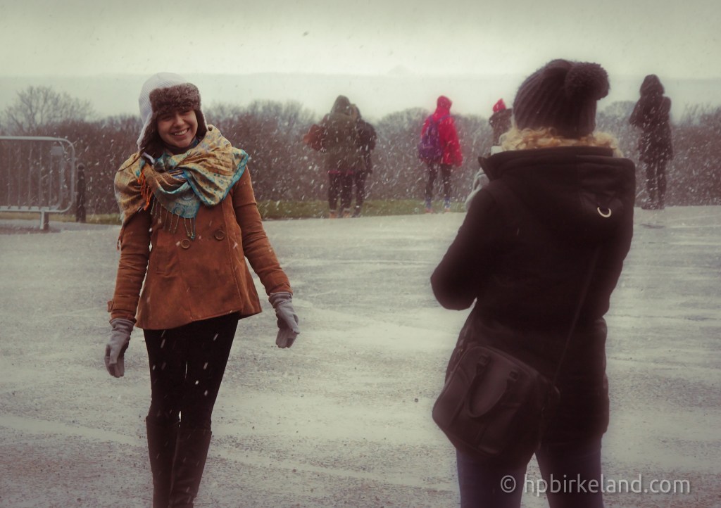 Tourist Enjoying the falling snow in Edinburgh, Scotland.